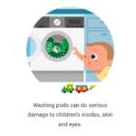 baby looking in washing machine